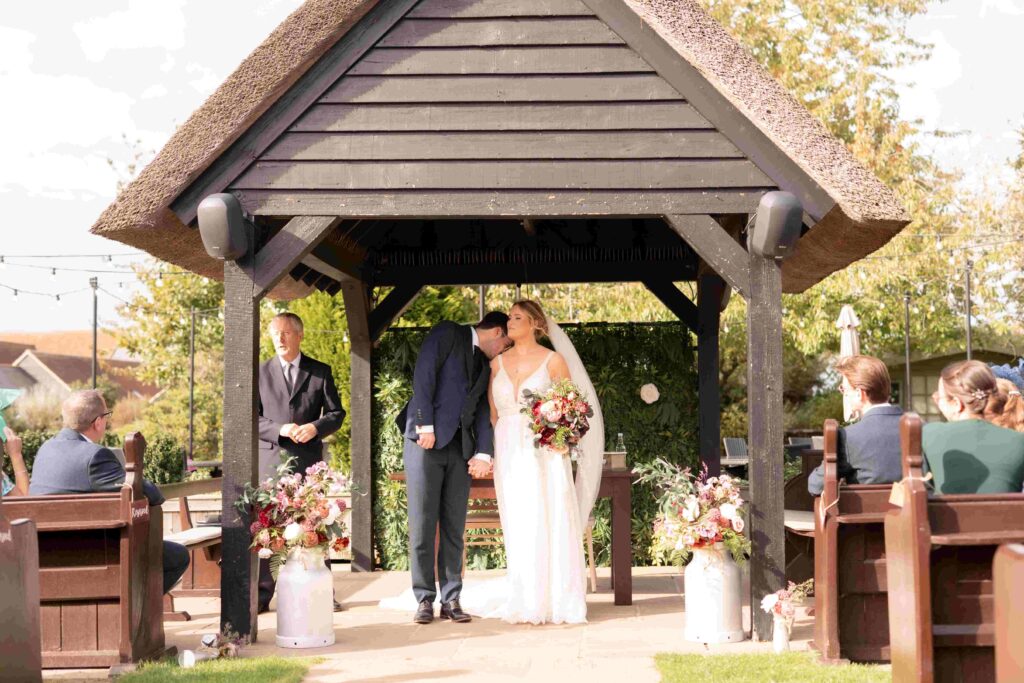 Intimate moment as the celebrant officially closes the ceremony at The Channels Estate, Essex.