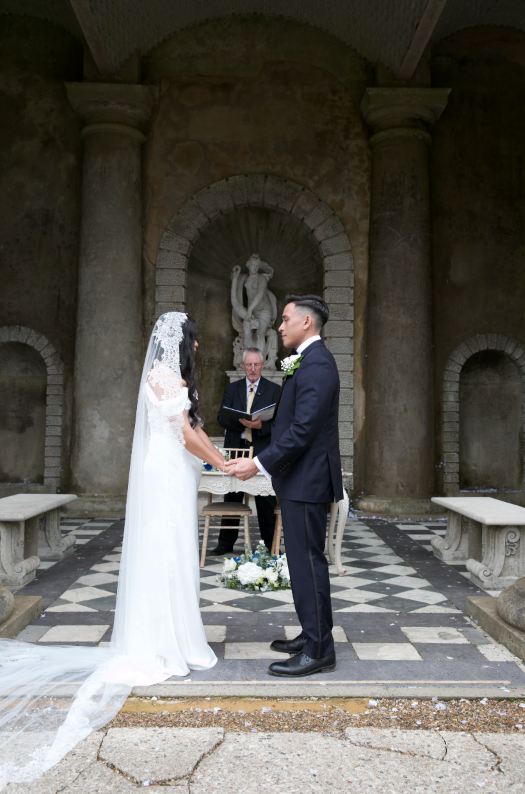 Couple exchanging vows during their ceremony at Wotton Hall.